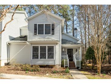 Charming two-story home featuring neutral siding, black shutters, and a welcoming front porch at 577 Woodbury, Pittsboro, NC 27312