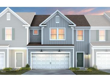 Charming two-story home with a two-car garage and a beautifully landscaped yard at 3412 Pelican Ln, Durham, NC 27703