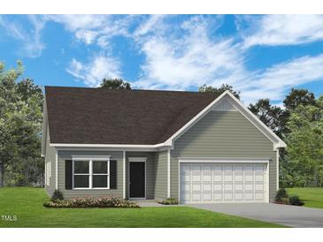 Charming one-story home with gray siding, black shutters and a white garage door, surrounded by lush green grass at 37 E American Marigold Dr # 35, Benson, NC 27504