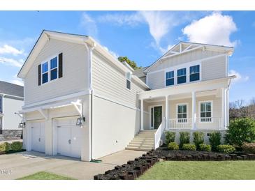 Charming two-story home with a landscaped yard, inviting front porch, and a spacious two-car garage at 200 Gravel Brook Ct, Cary, NC 27519