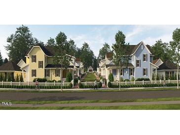 Charming new homes line a street, featuring colorful exteriors and inviting front yards at 2656 Welham Aly, Raleigh, NC 27608