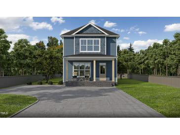 Charming two-story home with a welcoming front porch and a spacious driveway at 105 Sherwood Ln, Hillsborough, NC 27278