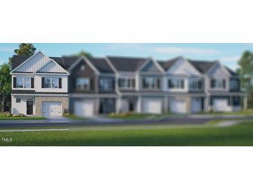 Charming new construction townhomes featuring inviting two-story floorplans and attached garages at 2207 Carcillar Dr, Apex, NC 27539