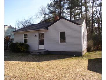 Cozy one-story home featuring vinyl siding, a new roof and trimmed front yard landscaping at 105 S Elizabeth St, Henderson, NC 27536