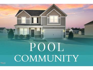 Charming two-story home featuring a two-car garage, well-maintained lawn, and inviting neutral-tone exterior at 109 Perignon Dr, Princeton, NC 27569