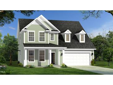 Charming two-story home with a two-car garage, covered front porch, and attractive landscaping at 141 Sugar Pine Drive, Franklinton, NC 27525