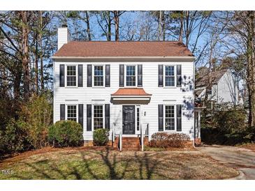 Charming two-story home with a classic design, featuring a well-manicured front yard at 105 Solstice Cir, Cary, NC 27513