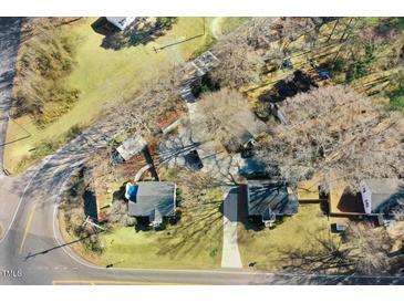 An aerial view of a neighborhood showcasing houses, mature trees, and lawns at 2867, 2851 Nc-210 & Galilee Hwy, Smithfield, NC 27577
