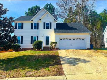 Charming two-story home with black shutters, attached garage, and well-maintained front lawn at 401 Maymount Dr, Durham, NC 27703