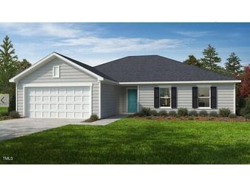 Charming single-story home features a two-car garage, a welcoming front porch, and low-maintenance landscaping at 120 Gobbler Dr, Smithfield, NC 27577