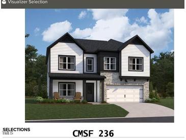 Two story home boasts a 2-car garage and modern black and white color scheme at 145 W Crescent Mills Blvd # Homesite 236, Clayton, NC 27520