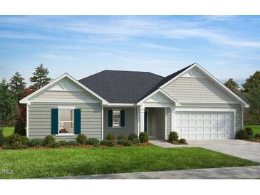 Charming single story home with light gray siding, white trim, an attached two car garage, and landscaped front yard at 178 Gobbler Dr, Smithfield, NC 27577