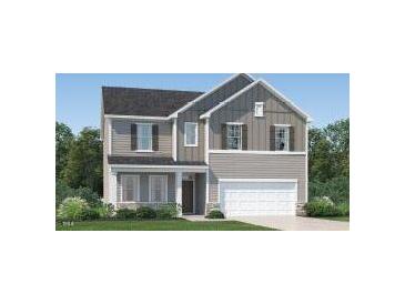 Charming two-story home with stone accents, a two-car garage, and a welcoming front porch at 601 Morning Light Dr, Angier, NC 27501