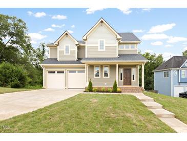 Charming two-story home with attached two-car garage and well-manicured lawn at 200 Single Tree Cir, Haw River, NC 27258
