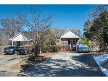 Charming brick home with a covered front porch and well-maintained landscaping at 2203 Eider Ct # A, Graham, NC 27253