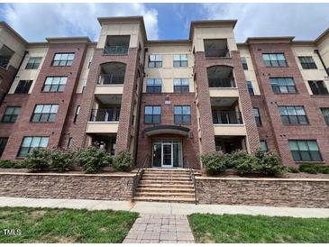 Attractive brick condominium building with multiple floors and balcony access at 700 Finsbury St # 304, Durham, NC 27703