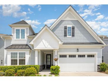 Charming home featuring a mix of gray shingle and lap siding and a black front door at 130 Ivory Ln, Raleigh, NC 27610