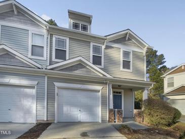 Charming townhome with attached garage, covered front porch, and neutral siding at 4820 Landover Arbor Pl, Raleigh, NC 27616