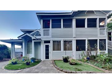 Charming two-story condo with manicured front yard and a quaint entryway, perfect for welcoming guests and enhancing curb appeal at 4911 Hollenden Dr, Raleigh, NC 27616
