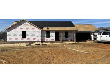 New construction shows brick base and partially installed roof on a single-story home at 59 N Movado Trl, Kenly, NC 27542