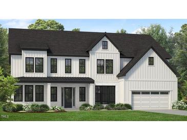 Charming two-story home featuring a modern farmhouse design with white siding, black trim, and a well-manicured lawn at 824 Timber Mist Ct, Cary, NC 27519