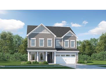 Charming two-story home with gray siding, white trim, and a well-manicured lawn at 840 Emerald Bay Cir, Raleigh, NC 27610