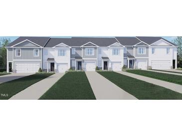 Charming townhomes featuring attached garages, white exteriors, and well-maintained lawns at 251 Perseus St, Angier, NC 27501