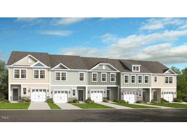 Charming townhomes featuring varied colors, attached garages, and beautiful landscaping at 46 Shay St, Angier, NC 27501