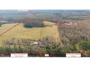 Expansive aerial view of the property and the surrounding landscape with projected lots outlined in red at 8835 Us 64, Siler City, NC 27344