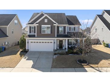 Charming two-story home with a welcoming front porch and a two-car garage at 917 Sequoia Ridge Dr, Fuquay Varina, NC 27526