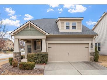 Charming home with a two-car garage, stone accents and manicured landscaping providing great curb appeal at 1003 Branwell Dr, Durham, NC 27703