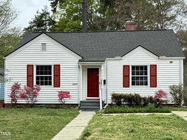 Charming home with red shutters, mature landscaping, and inviting front entrance, perfect for curb appeal at 2409 Shenandoah Ave, Durham, NC 27704
