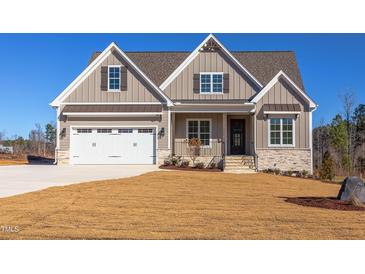 Charming single-Gathering home with a two-car garage and craftsman-style details on a sunny day at 75 Harvest View Way, Franklinton, NC 27525