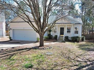 Charming one-story home with a landscaped front yard and a welcoming entrance porch at 8 Weeping Beech Way, Durham, NC 27713