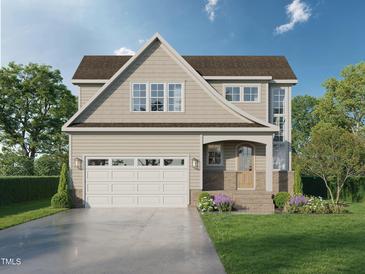 Charming two-story home with a two-car garage, welcoming entrance, and manicured lawn and beautiful landscaping at Lot 14 Grayhaven Pl, Raleigh, NC 27606