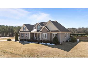 Spacious two-story home with neutral siding, a gabled roof, and a well-manicured front lawn at 29 Alban Row, Fuquay Varina, NC 27526