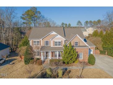 Charming two-story home boasts beautiful landscaping and inviting curb appeal at 3671 Coach Lantern Ave, Wake Forest, NC 27587