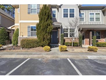 Charming townhome with manicured landscaping and a welcoming entrance at 684 Wickham Ridge Rd, Apex, NC 27539