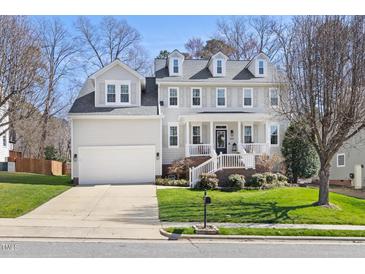 Charming two-story home with a manicured lawn and welcoming front porch at 804 Chancellors Ridge Dr, Durham, NC 27713