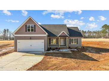 Charming craftsman style home with attached garage and covered porch at 9315 Turkey Way, Middlesex, NC 27557