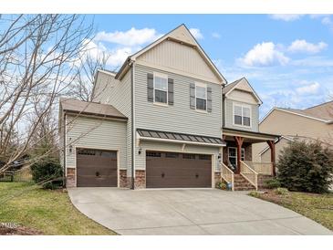 Charming two-story home with attached three-car garage and a spacious driveway at 1720 Waddell Ct, Durham, NC 27703
