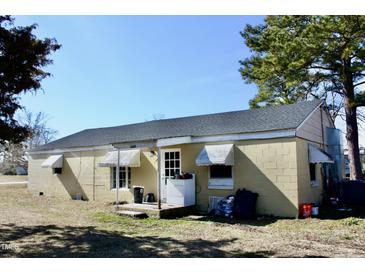 Modest single story home with a classic design and awning window covers at 1960 Brogden Rd, Smithfield, NC 27577