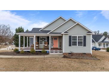 Charming single-Gathering home featuring a cozy front porch and welcoming curb appeal at 23 Sparkle Ln, Garner, NC 27529