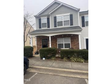 Charming two-story townhome with a stone-accented porch and well-maintained landscaping at 1304 Cozart St # 414, Durham, NC 27704