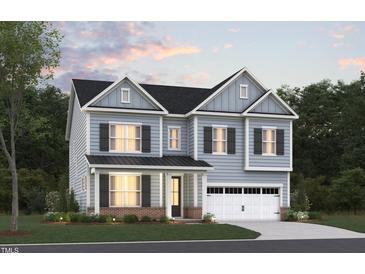 Charming two-story home featuring light blue siding, black shutters, and a two-car garage at 2100 Skipping Stone Dr # 160, Durham, NC 27705
