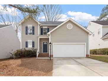 Charming two-story home featuring gray siding, a two-car garage, and a well-maintained front yard at 2121 Ramsgate St, Raleigh, NC 27603