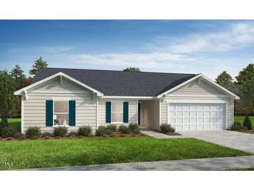 Charming single-story home with neutral siding, a two-car garage, and well-maintained landscaping at 51 Robert Howe Dr, Fuquay Varina, NC 27526