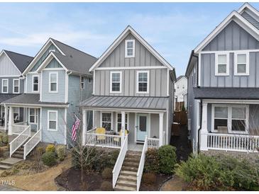 Charming two-story home with a welcoming porch and a well-maintained front yard at 656 Groveview Wynd, Wendell, NC 27591