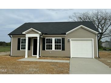 Charming single-story home featuring a covered entry, black shutters, and an attached one-car garage at 114 Johnson Ridge Way, Four Oaks, NC 27524