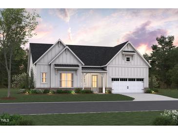 Charming modern farmhouse with white siding, black roof, and inviting front porch at 1212 Opal Ln # 91, Durham, NC 27705